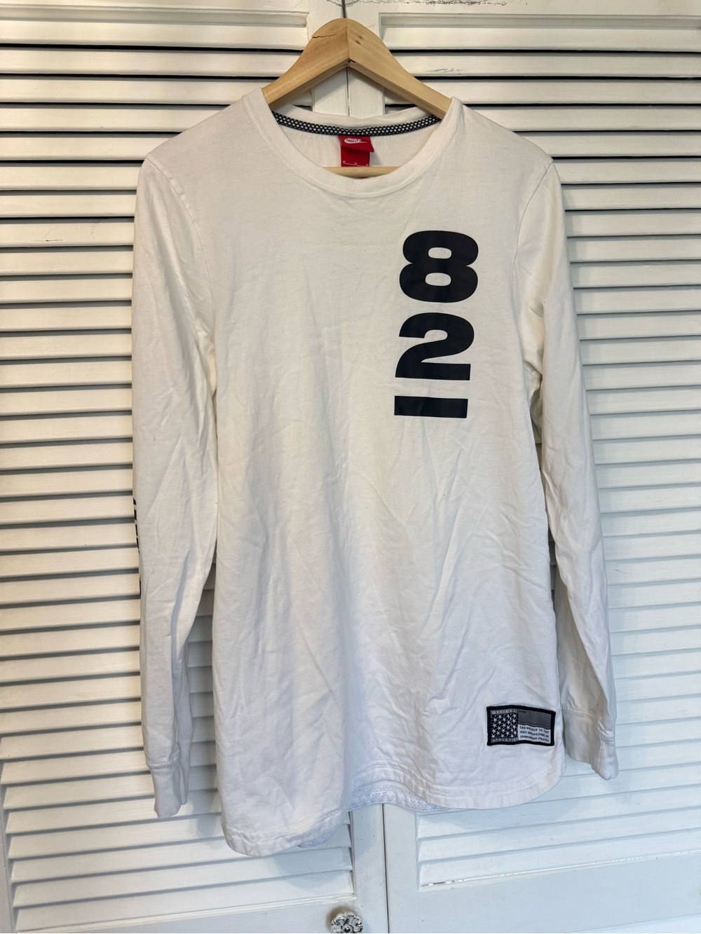 Nike White Long-Sleeve Tee with Navy '82' Vertical Graphic